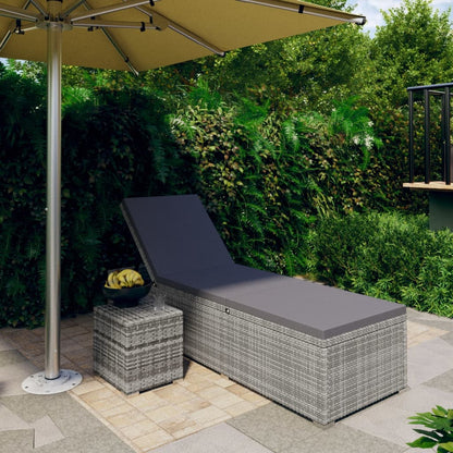 Sun lounger with cushion and coffee table in gray polyrattan